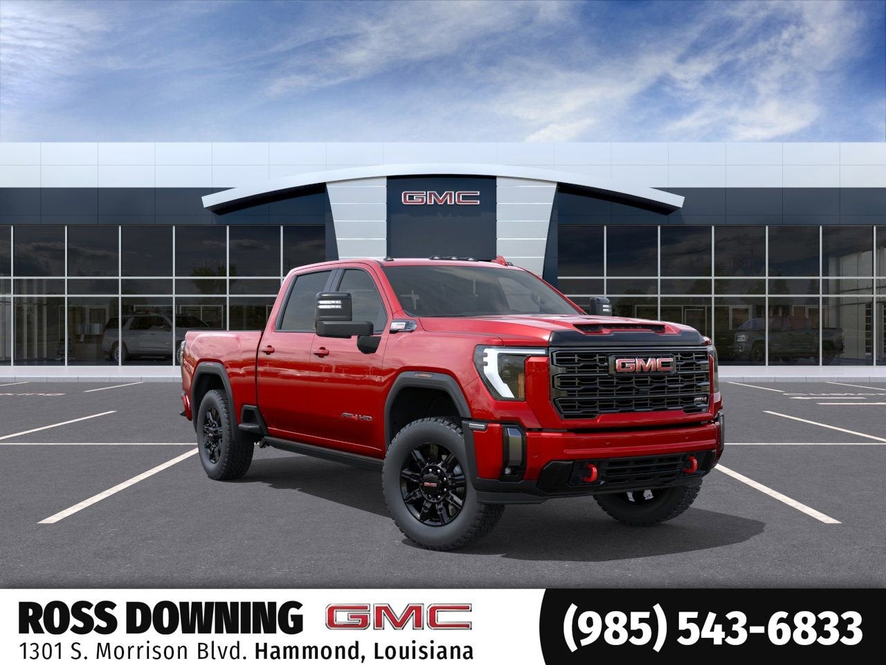 2026 GMC Sierra 2500 HD AT4 in Volcanic Red Tintcoat — front three-quarter view