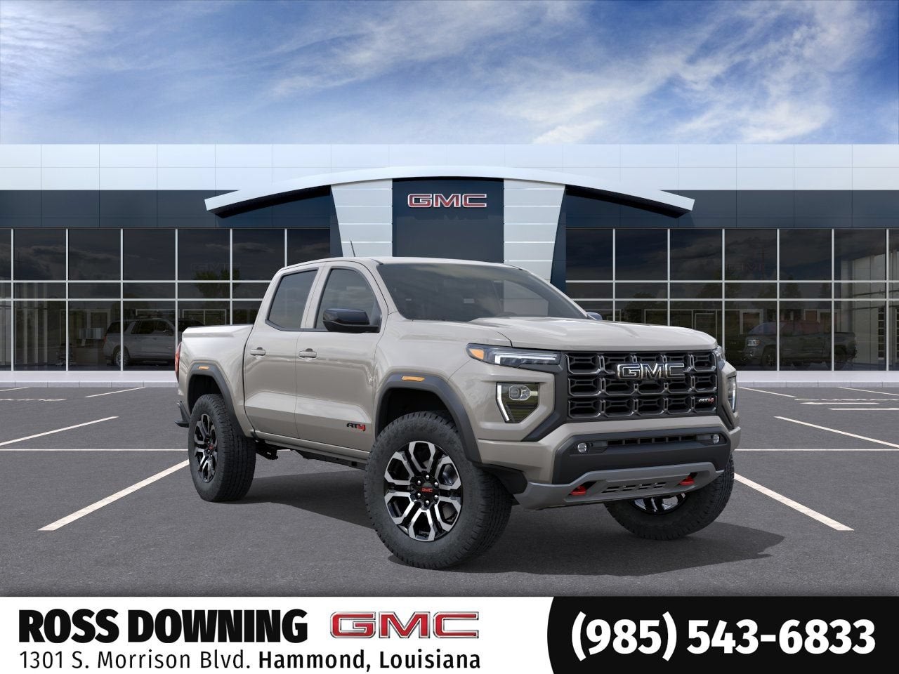 2026 GMC Canyon AT4 in Coastal Dune — front three-quarter view
