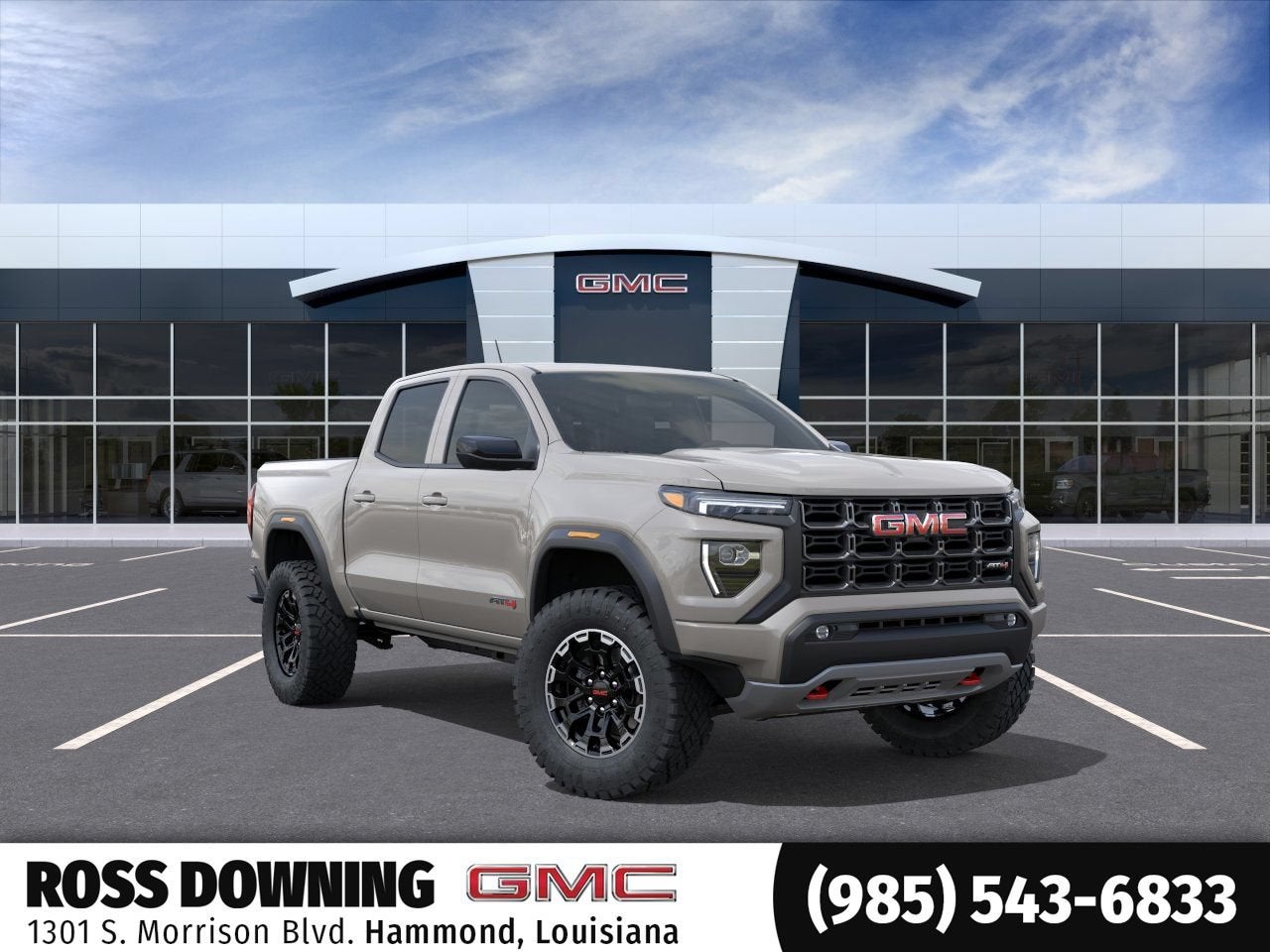2026 GMC Canyon AT4 in Coastal Dune — front three-quarter view