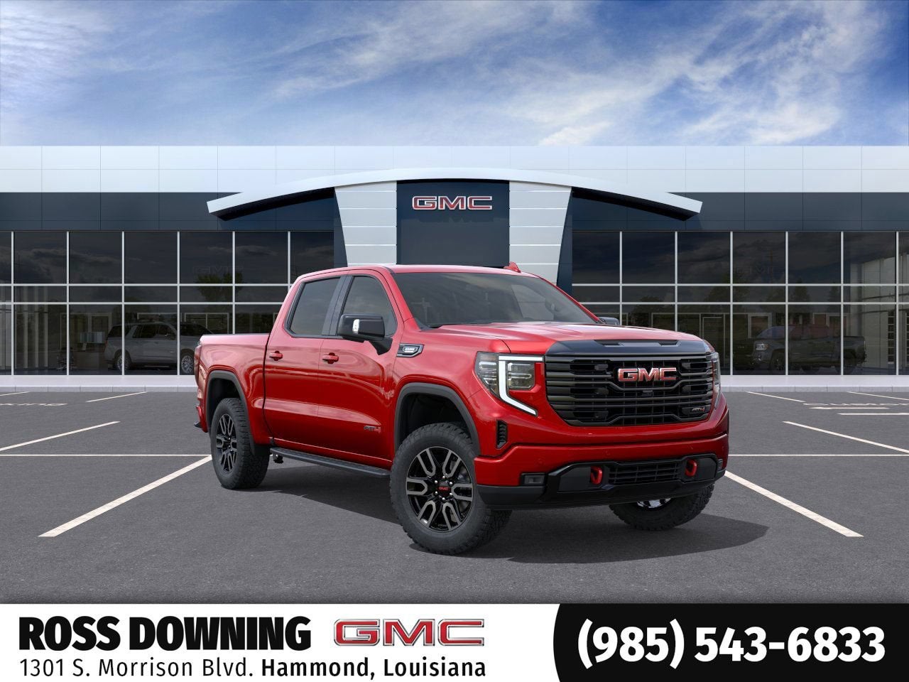 2026 GMC Sierra 1500 AT4 in Volcanic Red Tintcoat — front three-quarter view